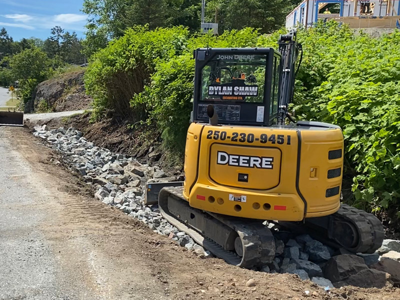 Dylan Shaw Excavating laying drainage rock in Port Hardy Vancouver Island