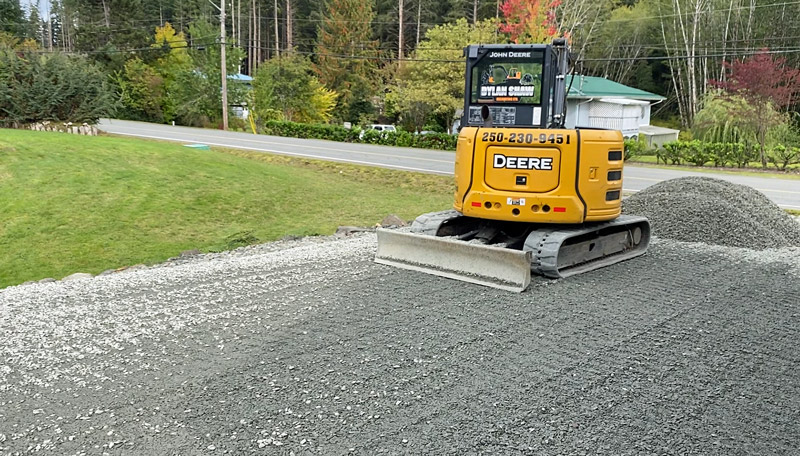 Dylan Shaw excavtor grading a driveway in Port Hardy North Vancouver Island