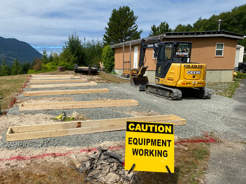 excavator operator creating garden beds in Northern Vancouver Island